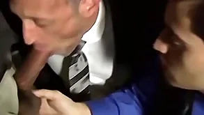 Hatless strigous radiate sucking two cocks in an orgy